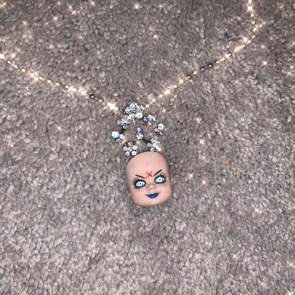 Handmade doll head necklace
